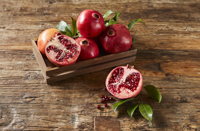 When I ate pomegranate often, did my bone density, blood vessels, and weight change?